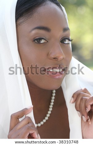 Muslim, Islamic woman: covering head with head scarf