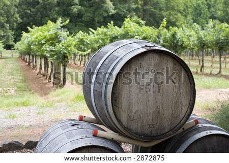 stacked wine barrels in front of vineyard in Hudson Valley, upstate New York.