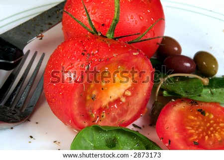 Tomato salad with cracked pepper, basil and olive oil.
