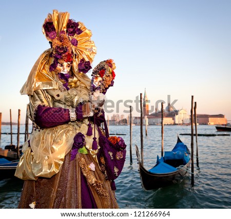 VENICE, ITALY - FEBRUARY 17: Unidentified person in Venice mask at St. Mark's Square, Carnival of Venice on February 17, 2012. Annual carnival was held in 2012 from February 11 to February 21, 2012.