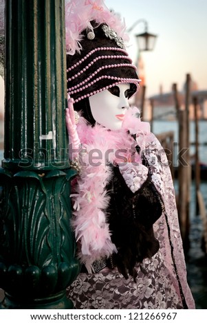 VENICE, ITALY - FEBRUARY 17: Unidentified person in Venice mask at St. Mark\'s Square, Carnival of Venice on February 17, 2012. Annual carnival was held in 2012 from February 11 to February 21, 2012.