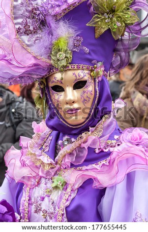 VENICE, ITALY - Februar 27, 2011: Woman in carnival costume is posing on Venice carnival in 2011. Venice is one of the world\'s top places to celebrate carnival.