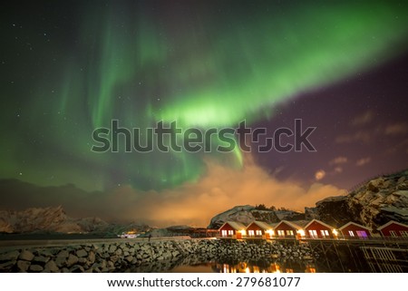 Aurora borealis in Mortsund harbour, near small town Leknes, Lofoten islands, Norway