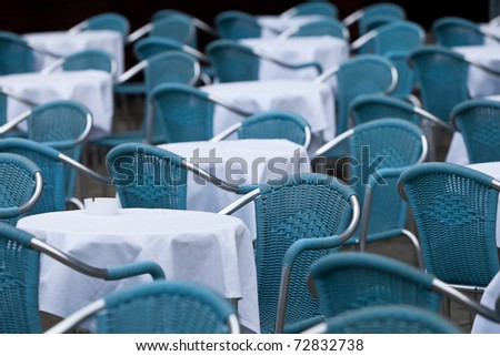 Many empty chairs in outdoor restaurant
