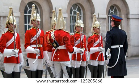 LONDON - APRIL 13: Official inspect the guards during the changing of the guard in Buckingham Palace, April 13, London 2011, England