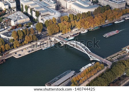 Aerial view of a boat cruising along the River Seine in Paris