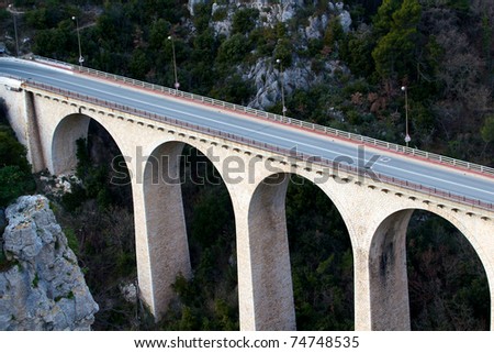 Paved Roads over Stone Arch bridge, south of France.