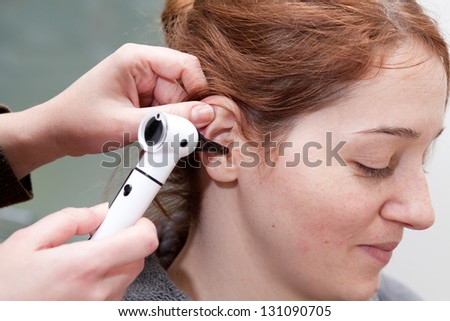 ear exam with otoscope