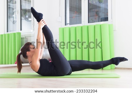 girl doing yoga in studio