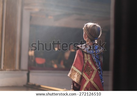 boy in medieval costume acting