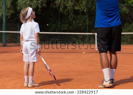 boy and his tennis coach