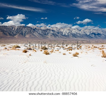 Mount Whitney and the Sierra Nevada rising above the Mojave Desert sands