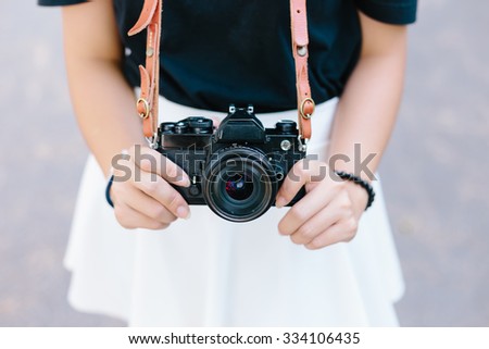 Asian girl and black vintage film camera