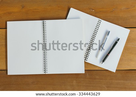 pen, pencil and empty notepad or notebook. flat lay style