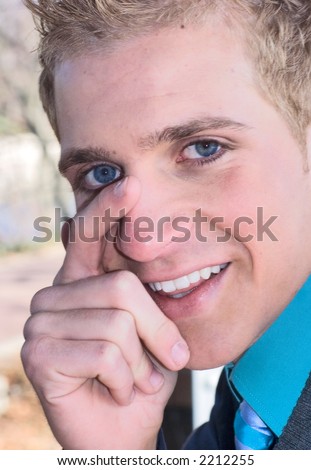 good looking man with shy smile