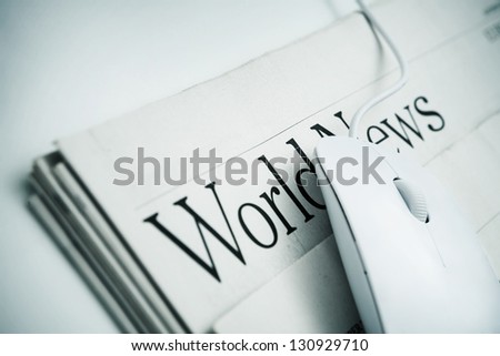 Online News -Computer mouse and Newspaper