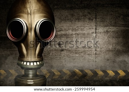 Gas mask shrouded in smoke on wall background
