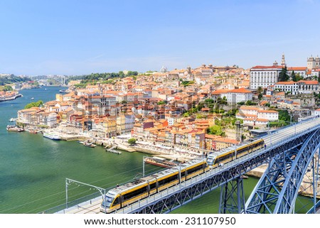 Porto with the Dom Luiz bridge. A metro train can be seen on the bridge, Portugal