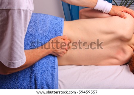 Young man gets back massage