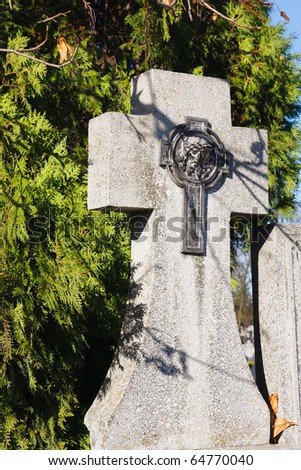 Stone cross with metal figurine of jesus christ