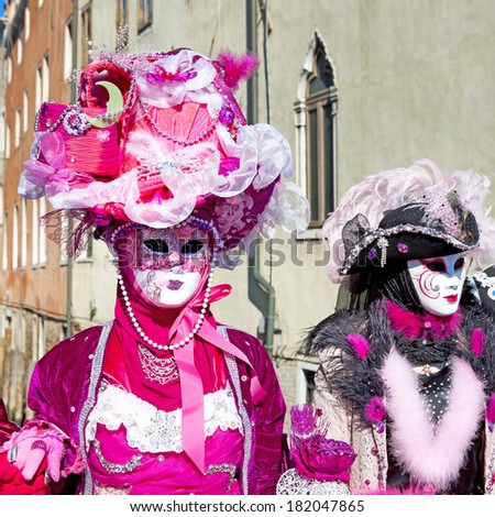 VENICE, ITALY, FEBRUARY 23, 2014: Carnival of Venice, beautiful masks at St. Mark\'s Square