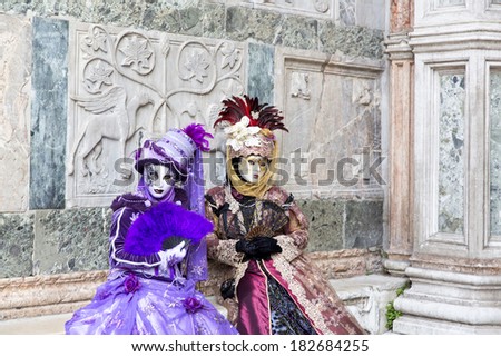 VENICE, ITALY, FEBRUARY 23, 2014: Carnival of Venice, beautiful masks at St. Mark\'s Square