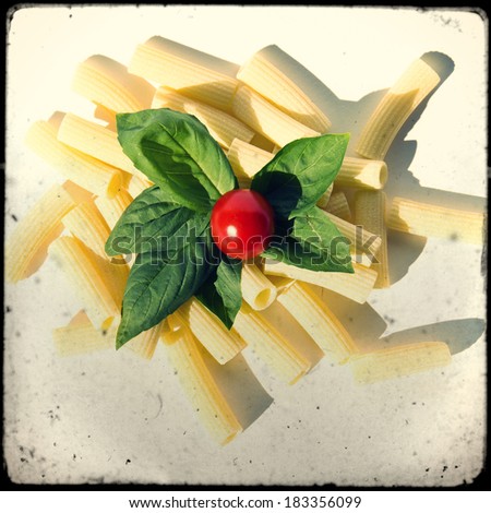 Uncooked pasta with basil and tomato of Pachino, Sicily