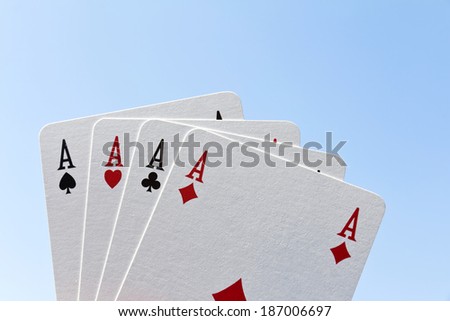 Playing cards on a blue background. Poker of aces