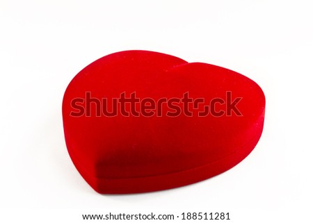 Heart\'s shape red velvet box on white background