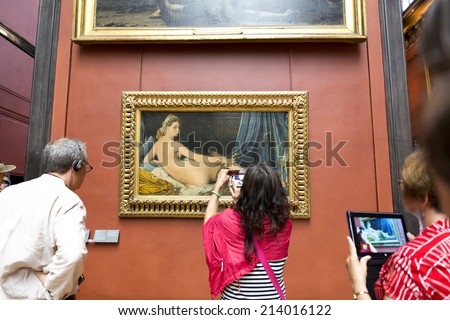 PARIS, FRANCE, August 6, 2014: Grande Odalisque, also known as Une Odalisque or La Grande Odalisque, is an oil painting of 1814 by Jean Auguste Dominique Ingres. The work is displayed in the Louvre.