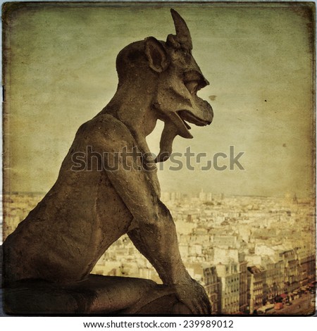 Notre Dame of Paris: Famous Chimera, demon, overlooking the Eiffel Tower at a summer day in vintage style