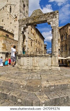 SAN GIMIGNANO, ITALY, August 7, 2011: Tourists in San Gimignano, Italy. UNESCO declared the town a World Heritage Site.