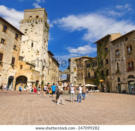 SAN GIMIGNANO, ITALY, August 7, 2011: Tourists in San Gimignano, Italy. UNESCO declared the town a World Heritage Site.