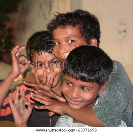 KARACHI, PAKISTAN - SEPT. 8: Poverty-stricken, street kids pose for the camera at a commercial street in Karachi, Pakistan on September 8, 2010