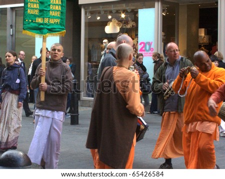 LONDON - MAY 13:  Unidentified participants of the Hare Krishna parade at Covent Garden on May 13, 2010 in London, England.