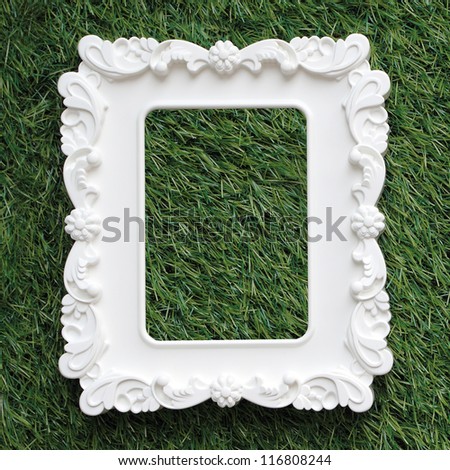 photo frame isolated on green grass