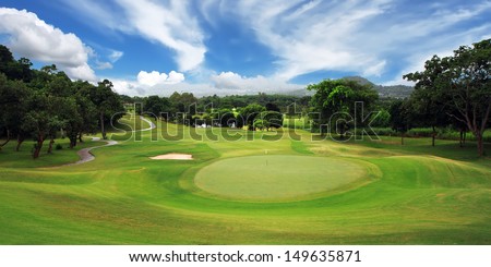 green golf course and blue sky