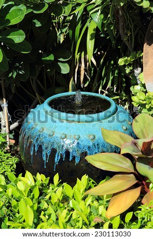 water jar and fountain in the garden