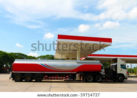 Red fuel truck in gas station
