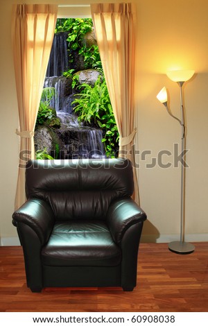 black sofa and lamp in front of waterfall