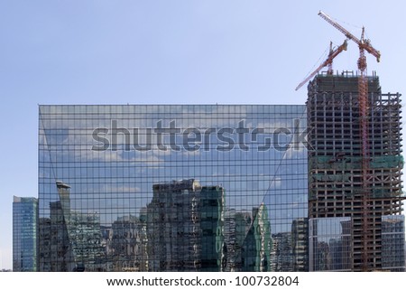 Reflections in office building and new highrise, Beijing, China