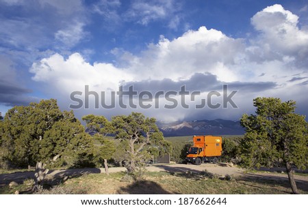 WILD RIVERS RECREATIONAL AREA, NEW MEXICO, USA - April 14: Camping with custom orange RV truck on April 14, 2014 at Wild Rivers Recreational Area, New Mexico, USA.