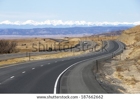 Winding highway in New Mexico with views of the Rocky Mountains