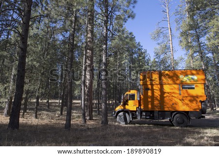 SANTA FE NATIONAL FOREST, NEW MEXICO, USA - April 17: Camping with custom orange RV truck on April 17, 2014 at Santa Fe National Forest, New Mexico, USA.