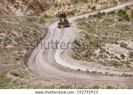 Grader working on dirt road in Arizona