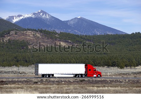 Semi truck going fast on mountain highway