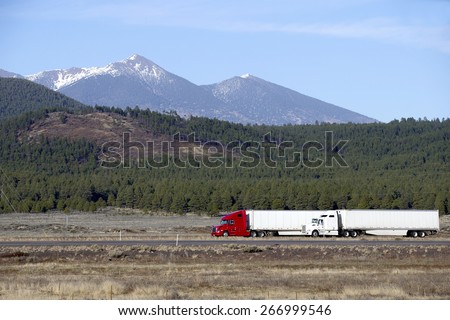 Semi truck going fast on mountain highway
