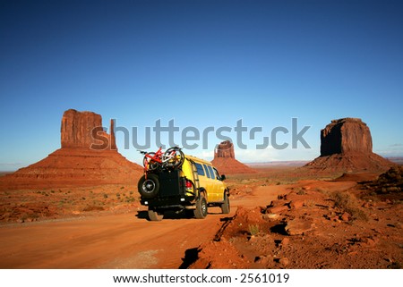 Yellow Van with Mountain bikes in Monument Valley
