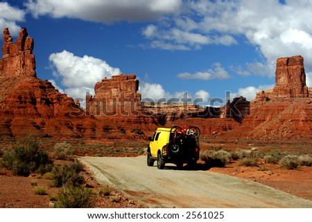 Yellow Van with Mountain bikes in Valley of Gods, Utah