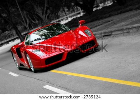 stock photo Red Ferrari Enzo on the road in Singapore